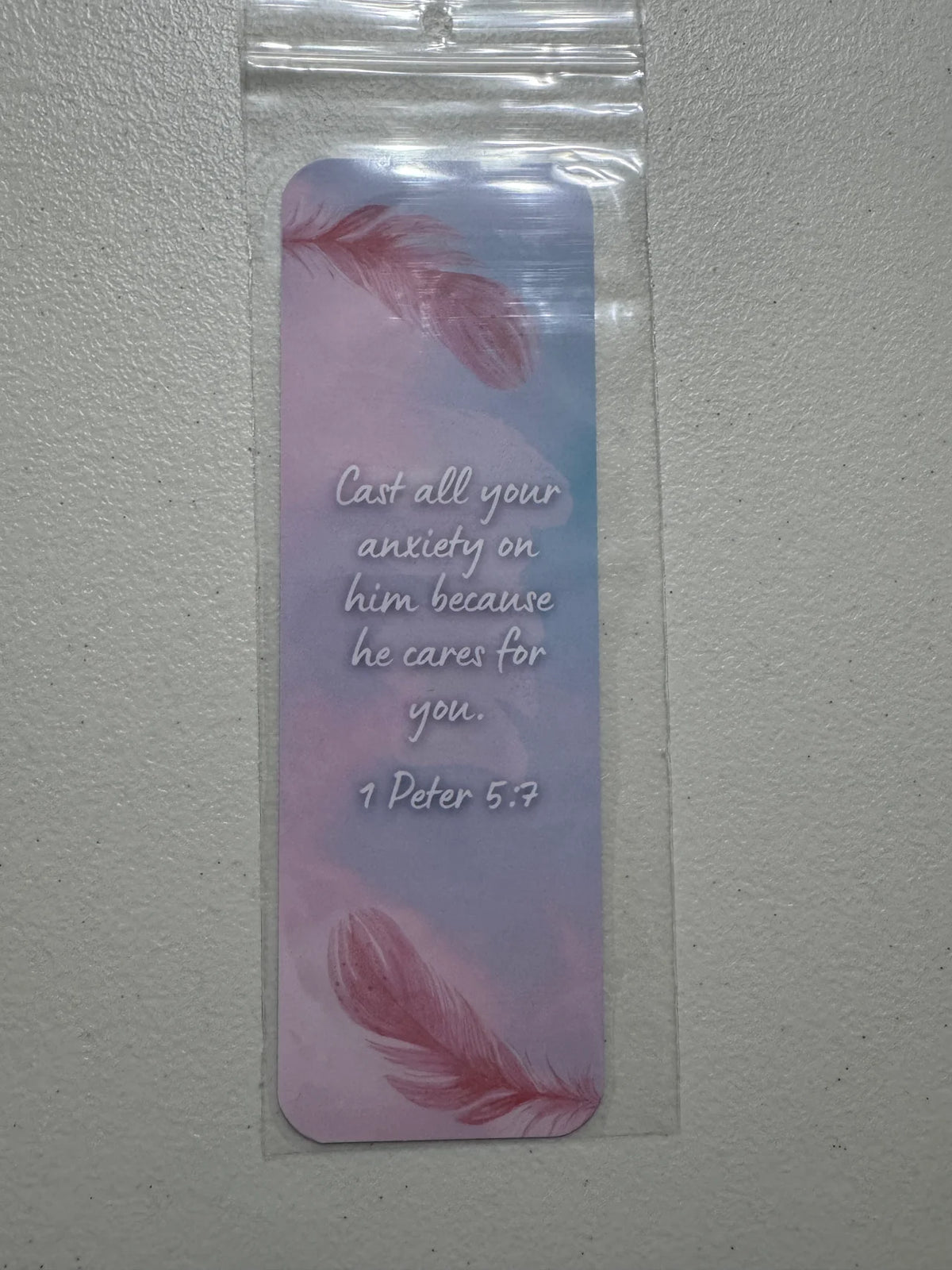 1 Peter 5:7 two feathers faith bookmark